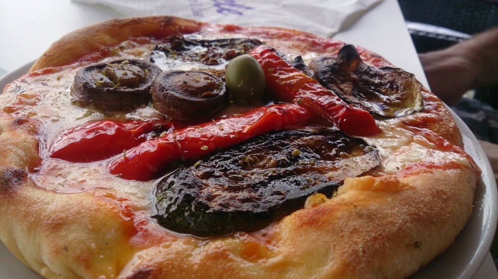 Freshly baked pizza with char grilled vegetables and olive oil